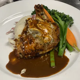 Mary&apos;s organic chicken topped with citrus-lavender butter, chicken jus. Paired with steamed seasonal vegetables, and garlic mashed potatoes.
