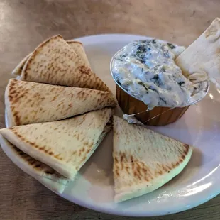 a plate of quesadillas and dip