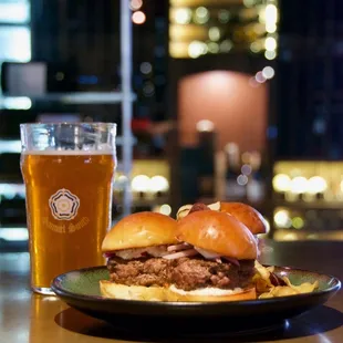 a plate of food and a glass of beer