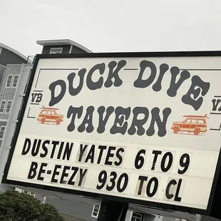 a sign in front of a building