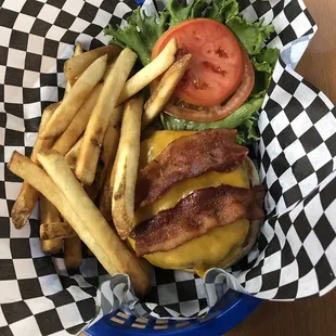 a basket of fries and bacon