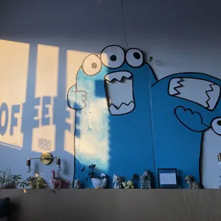 a wall with a blue bird on it