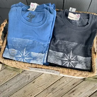 two t - shirts in a basket