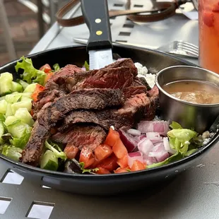 Steak salad that my petite friend loved so much, she ate every bite