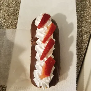Chocolate Frosted Long John with Whipped Cream and Strawberries