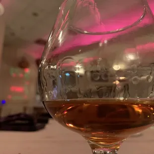 a glass of wine on a table