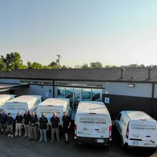 Outside our new building with our Duct Squad team and working Vans.