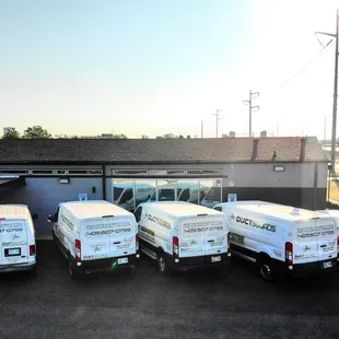 Outside our new building with our working Vans.