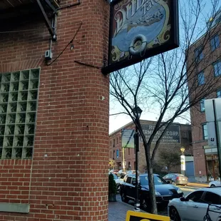 a sign on a brick building