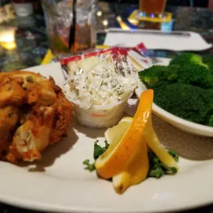 Crab cake meal comes w/potato chips and slaw. I upgraded to broccoli. 'Cause I like my veg. But you can get fries.