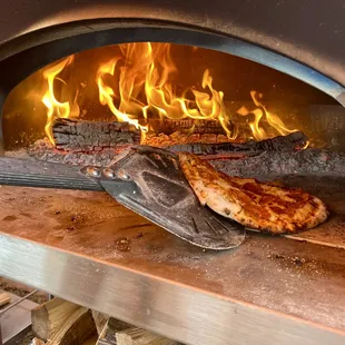 a pizza being cooked