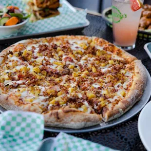 a pizza, salads, and drinks