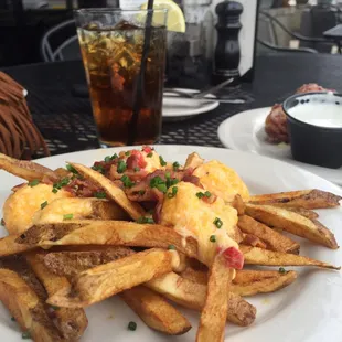 Pimento cheese fries. House cut French fries, bacon, pimento cheese, and chives.