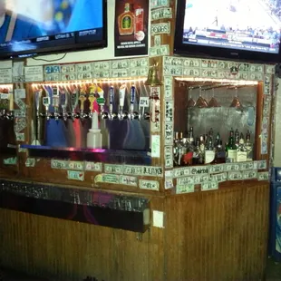 What does the money on the wall represent?