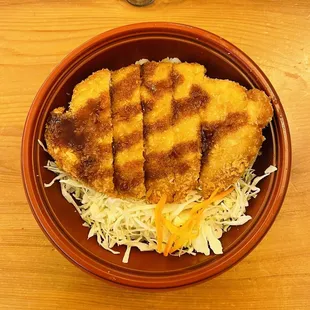 a plate of food on a wooden table