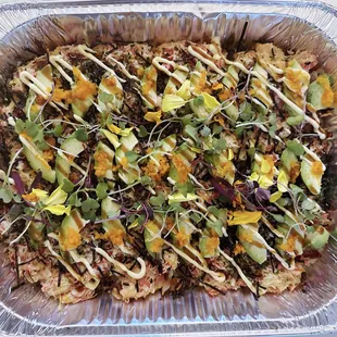 Sushi Bake 
Layered by Sushi Rice, Yaki tamago,  Imitation Crab, Salmon, Tuna, Furikake, Tobiko Avocado,  Served by crispy roasted seaweed