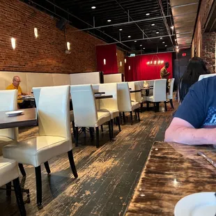 a man sitting at a table in a restaurant