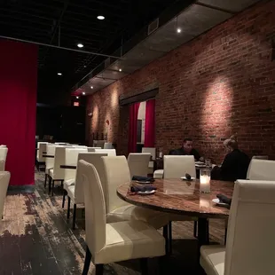 a dining area with tables and chairs