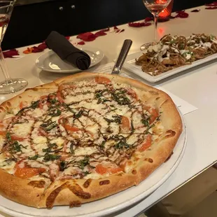 a pizza on a white plate on a table