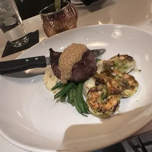 Steak special of the night with a mustard sauce atop some sort of grit thing with shrimp. My husband loved it