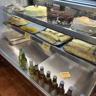 a display case with a variety of baked goods