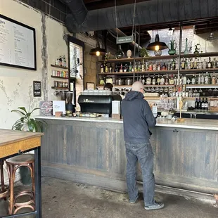 a man standing at a bar