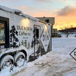 a truck parked in the snow