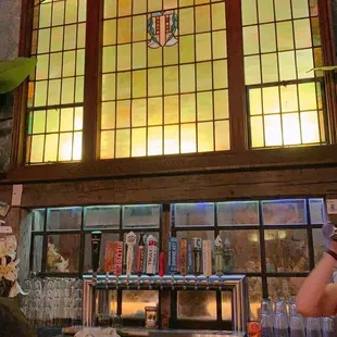 a bar with a stained glass window