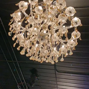 a crystal chandelier hanging from the ceiling