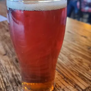 a glass of beer on a table