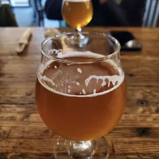 a glass of beer on a table