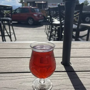 a glass of beer on a table