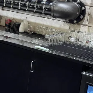 Tampon by the cups and beer taps