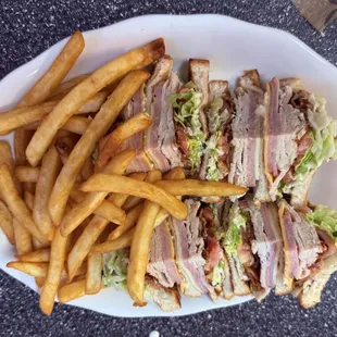 Club sandwich with French fries