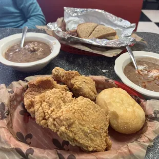 Fried chicken, red beans &amp; rice and a chicken sandwich in back.