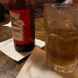 a glass of beer and a bottle of beer