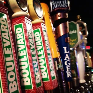 a row of beer taps