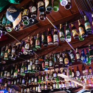 a wall full of beer bottles