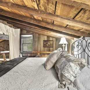 Cabin's primary loft with a King-sized bed.