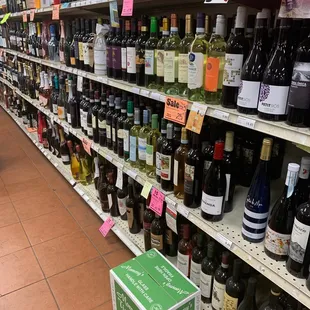 rows of wine bottles on shelves