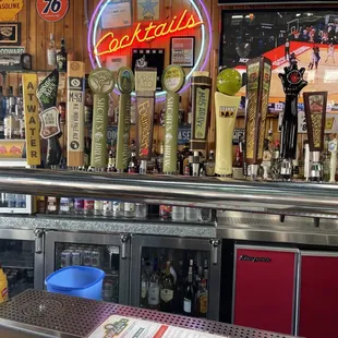 a bar with beer taps
