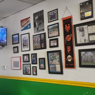 a wall full of sports memorabilia