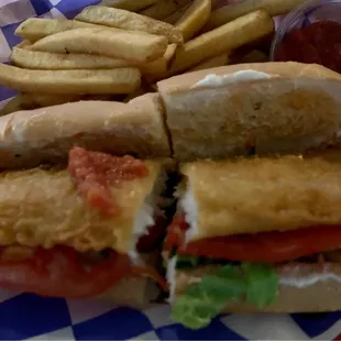 Belly Buster fried fish sub ($8.99) with a side of fries  ($2) and cocktail sauce