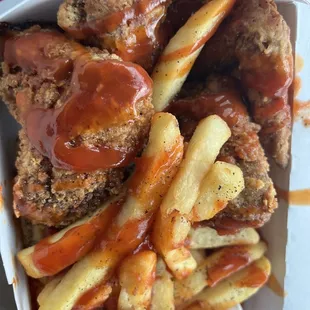 a box of fried chicken and french fries
