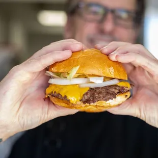 sSmash Burger! 1/3 lb Angus beef, ranch, iceberg lettuce, American cheese, white onions, challah roll, and a house-made sauce! Try it!