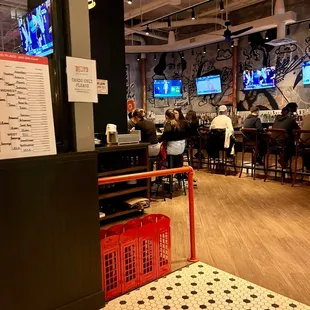 people sitting at tables in a restaurant