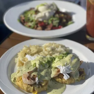 SHRIMP &amp; SALSA VERDE BENNY Grilled shrimp, poached egg, salsa verde hollandaise and served on a tamale cake. Served with creamy hash