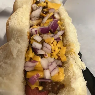 The chili dog I was talking about. I love the way they put use this cut up cheese and onions. Just wanted a bit more chili. HUGE dog though