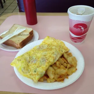 Omelet and home fries with toast