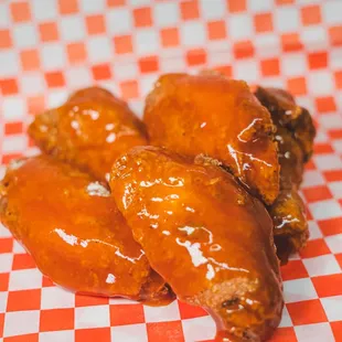 three wings on a checkered tablecloth